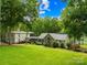 Charming lakeside home with lush lawn, mature trees, and attached guest house at 698 Normandy Rd, Mooresville, NC 28117