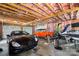 Spacious garage with lots of storage for vehicle enthusiasts with high ceilings and natural light at 698 Normandy Rd, Mooresville, NC 28117