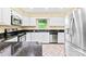 Stylish kitchen with stainless steel appliances, black granite countertops, and white cabinets at 698 Normandy Rd, Mooresville, NC 28117