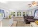 Open-concept living space featuring a seamless flow with ample light and access to back porch through french doors at 698 Normandy Rd, Mooresville, NC 28117