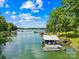 Picturesque waterfront view with boat dock, perfect for lake living at 698 Normandy Rd, Mooresville, NC 28117