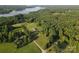 Stunning aerial view of the lake property with lush greenery and serene surroundings at 746 Joe Lentz Rd, Salisbury, NC 28146