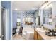 A well-lit bathroom features a bathtub, toilet, vanity, framed mirror, and decorative wallpaper at 746 Joe Lentz Rd, Salisbury, NC 28146