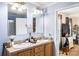 Bathroom features a vanity with double sinks, a framed mirror, a toilet, and a walk-in shower at 746 Joe Lentz Rd, Salisbury, NC 28146