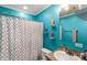 Cozy bathroom with bright blue walls, modern fixtures, and decorative shelving at 746 Joe Lentz Rd, Salisbury, NC 28146