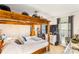 Bedroom with a unique wooden canopy bed frame, carpet flooring, and a window with curtains at 746 Joe Lentz Rd, Salisbury, NC 28146