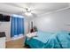 Bedroom featuring carpet flooring, a ceiling fan, blue walls, and a window with blue curtains at 746 Joe Lentz Rd, Salisbury, NC 28146