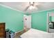 Bright bedroom featuring green walls, white trim, and a ceiling fan at 746 Joe Lentz Rd, Salisbury, NC 28146