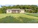 Inviting single-story house with a front porch and covered parking on a large, green lawn at 746 Joe Lentz Rd, Salisbury, NC 28146