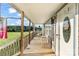 Cozy front porch with wooden railings, a swing, and a 'Welcome to our Home' door decoration at 746 Joe Lentz Rd, Salisbury, NC 28146
