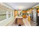 Well-lit kitchen with island, wooden cabinets, stainless steel appliances, and large windows at 746 Joe Lentz Rd, Salisbury, NC 28146