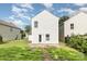 The back exterior shows a house with white siding and a small yard at 7643 Monarch Birch Ln, Charlotte, NC 28215