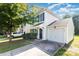 Charming two-story home with a single-car garage, complemented by a tidy lawn and driveway, and refreshed paint at 7643 Monarch Birch Ln, Charlotte, NC 28215