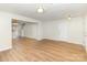 Bright open-concept living space with hardwood floors, neutral paint, and ample lighting fixtures; perfect for entertaining at 7643 Monarch Birch Ln, Charlotte, NC 28215