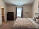 Bedroom with a large bed, dresser, window, and a view of the ensuite bathroom at 811 Constantine Rd, Richburg, SC 29729