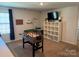 Spacious bonus room with a foosball table and shelves for ample storage and entertaining at 811 Constantine Rd, Richburg, SC 29729