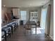 Bright dining area featuring wood floors, a table, and a hutch, with a sliding door to the outside at 811 Constantine Rd, Richburg, SC 29729