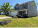 Charming two-story home featuring a well-manicured lawn, a two car garage, and a welcoming front porch at 811 Constantine Rd, Richburg, SC 29729
