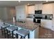 Kitchen island featuring granite countertops, seating, and stainless steel appliances at 811 Constantine Rd, Richburg, SC 29729