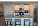 Modern kitchen island with granite countertops, seating, and stainless steel appliances at 811 Constantine Rd, Richburg, SC 29729