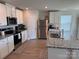 Modern kitchen featuring stainless steel appliances, granite countertops, and white cabinetry at 811 Constantine Rd, Richburg, SC 29729