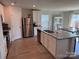 Modern kitchen with stainless steel appliances, granite countertops, a kitchen island and light wood floors at 811 Constantine Rd, Richburg, SC 29729