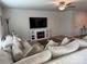 Bright and airy living room featuring a large sectional, a modern fireplace, and neutral décor at 811 Constantine Rd, Richburg, SC 29729