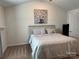 Cozy main bedroom featuring neutral walls, carpet, a comfy bed, and vaulted ceilings at 811 Constantine Rd, Richburg, SC 29729