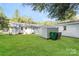 Large grassy backyard with storage shed, perfect for outdoor activities and relaxation at 835 Carrington Dr, Charlotte, NC 28214