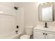 This bathroom has white tiling in the shower and tub, black hardware, and a vanity at 835 Carrington Dr, Charlotte, NC 28214