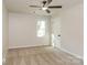 Neutral bedroom with ceiling fan, carpet flooring, a window, and natural light at 835 Carrington Dr, Charlotte, NC 28214