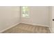 Neutral bedroom with carpet flooring, a window, and natural light at 835 Carrington Dr, Charlotte, NC 28214