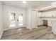 Eat in kitchen area featuring modern floors, French doors, and stainless appliances at 835 Carrington Dr, Charlotte, NC 28214