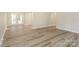 Open living space featuring modern floors, neutral paint and rear French doors at 835 Carrington Dr, Charlotte, NC 28214