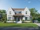 Stunning two-story white brick home with black trim, manicured lawn, and a welcoming front porch at 914 Edinburgh Ln, Charlotte, NC 28209