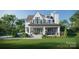 Elegant white home boasting a spacious covered patio for entertaining and a beautifully landscaped yard at 914 Edinburgh Ln, Charlotte, NC 28209