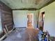 Bedroom featuring hardwood floors, bright window, and doorway to kitchen at 1004 S Ridge Ave, Kannapolis, NC 28083