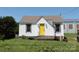 Charming home featuring a bright yellow front door and well-maintained vinyl siding at 1004 S Ridge Ave, Kannapolis, NC 28083