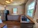 Kitchen featuring a stainless refrigerator, wooden countertops, and updated cabinets at 1004 S Ridge Ave, Kannapolis, NC 28083