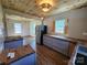 Open kitchen with butcher block counters, stainless steel fridge, and vinyl floors at 1004 S Ridge Ave, Kannapolis, NC 28083