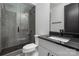 Modern bathroom with sleek vanity, glass-enclosed shower, and contemporary fixtures for a luxurious feel at 10119 Laurier Ln, Huntersville, NC 28078