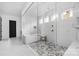Stunning bathroom with glass shower, soaking tub, and stylish tile flooring at 10119 Laurier Ln, Huntersville, NC 28078