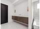 Bathroom featuring a modern floating vanity and marble tile floors at 10119 Laurier Ln, Huntersville, NC 28078