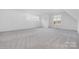 Bright and airy bonus room with multiple windows, providing plenty of natural light and space at 10119 Laurier Ln, Huntersville, NC 28078