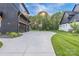Long driveway leading to home and garage, basketball hoop, and lush green lawn at 10119 Laurier Ln, Huntersville, NC 28078