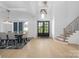 Spacious foyer with a dining room, staircase, and hardwood floors at 10119 Laurier Ln, Huntersville, NC 28078