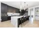 Well-appointed kitchen with large island, seating, and stainless appliances at 10119 Laurier Ln, Huntersville, NC 28078