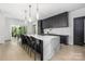 Open kitchen featuring an oversized island with seating and modern appliances at 10119 Laurier Ln, Huntersville, NC 28078