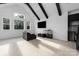 Inviting living area featuring large windows, providing ample natural light and comfortable seating arrangement at 10119 Laurier Ln, Huntersville, NC 28078