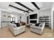 Open-concept living room with dark accents and views of the entry way at 10119 Laurier Ln, Huntersville, NC 28078